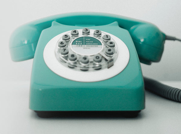 A rotary phone with push buttons.