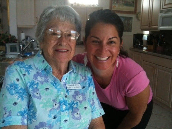 grandmother and granddaugher smiling together