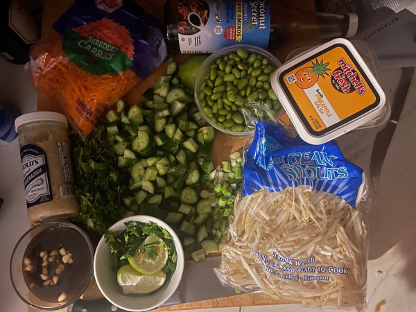 image of all of the ingredients for the rice bowl on a cutting board.
